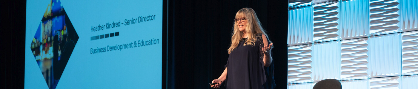Woman speaking at an event`