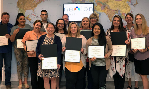 A small group of agents showing their certificates