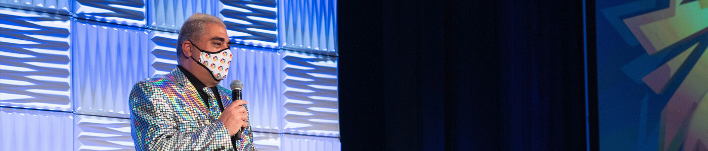A man speaking at an event