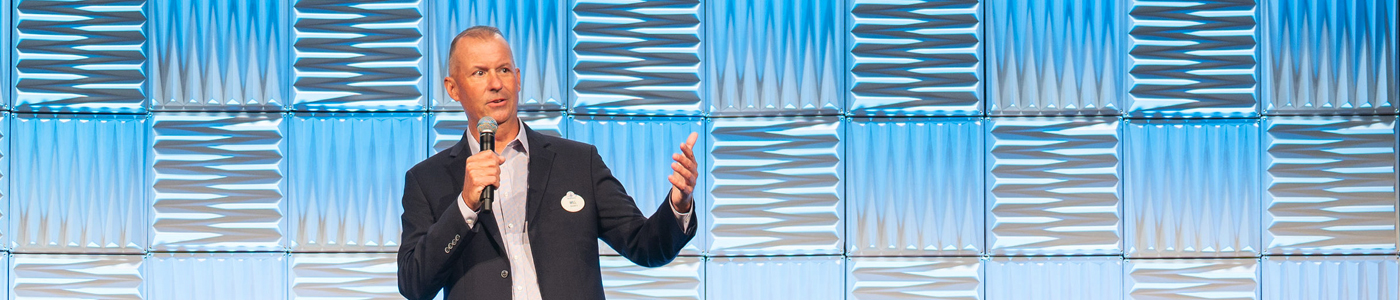 A man speaking at an event