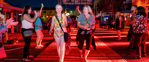 People walking down a red carpet