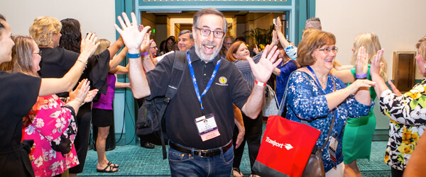 Happy people coming out of an event