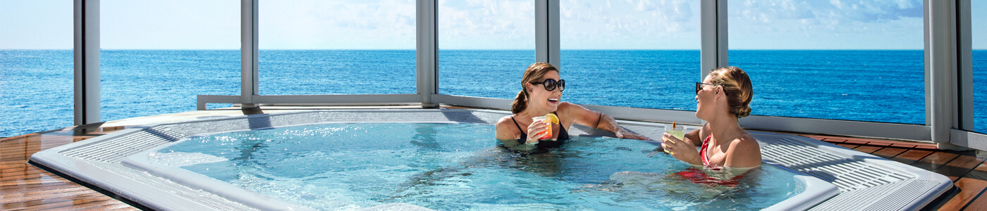 Woman drinking in a hot tub on a ship