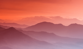 Rolling mountains at sunset