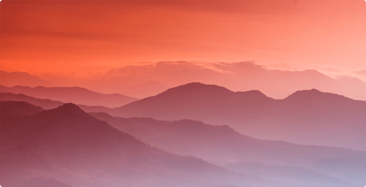 Rolling mountains at sunset